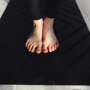 Close up of feet on a mat