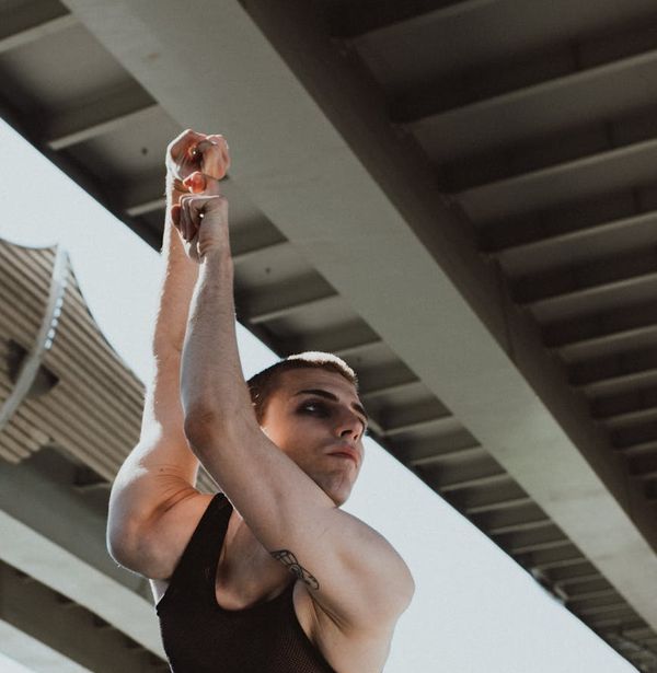 Person performing a bridge pose with focus